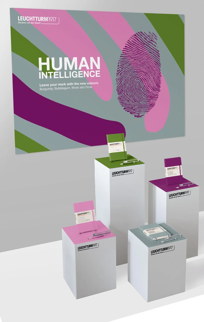Supplier example of a HUMAN INTELLIGENCE shop-window presentation centered on colorful notebooks and campaign graphics